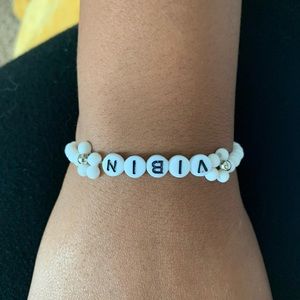 White flower brackets with words